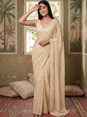 Cream striped sequinned poly georgette designer saree 1