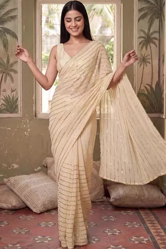 Cream striped sequinned poly georgette designer saree