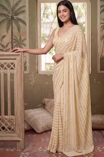 Cream striped sequinned poly georgette designer saree