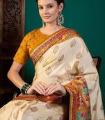Cream ethnic motifs printed saree with unstitched blouse
