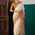 Cream ethnic motifs printed saree with unstitched blouse