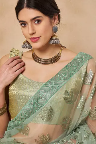 Green georgette embellished saree with matching blouse