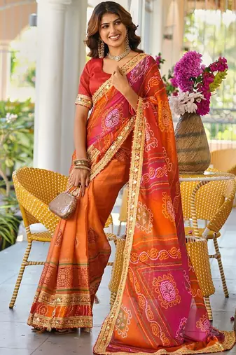 Red printed lace border bandhani sarees with contrast blouse piece