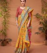 Yellow women ethnic motifs printed viscose rayon saree