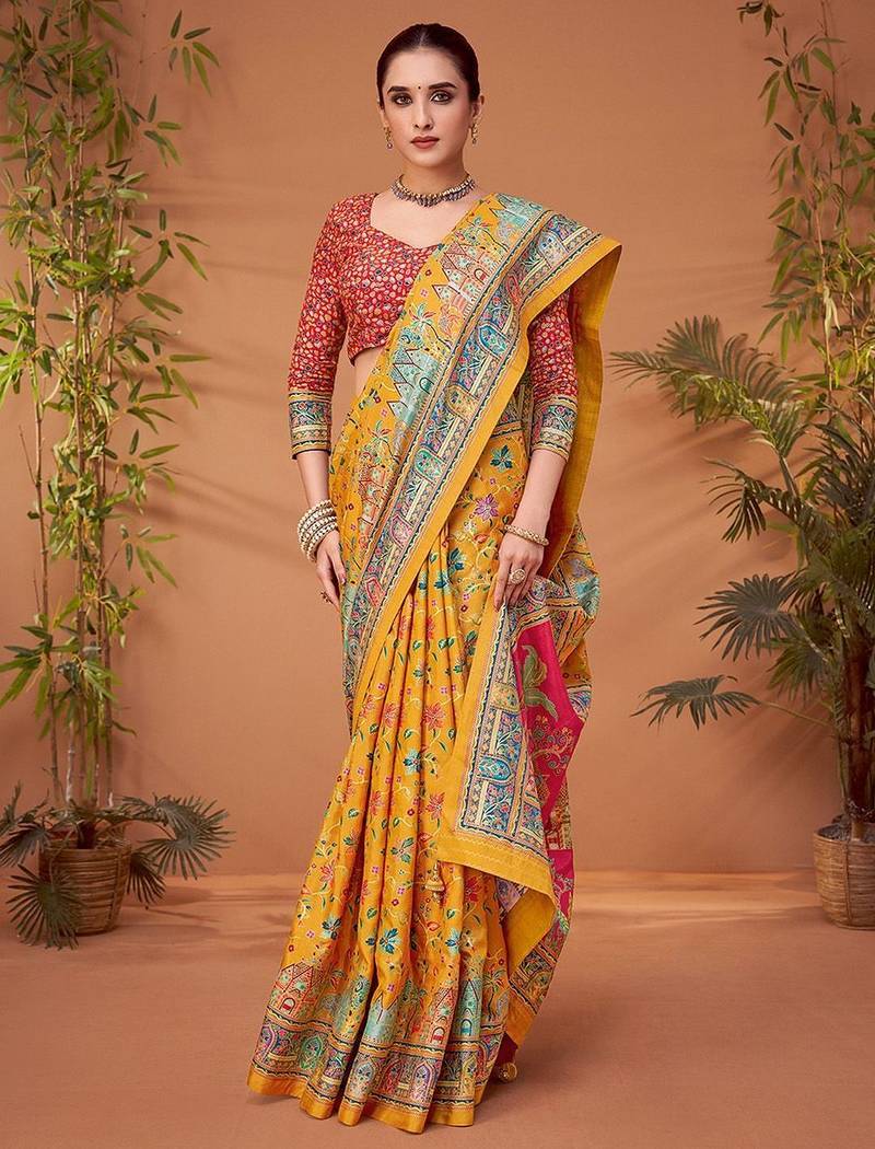 Yellow women ethnic motifs printed viscose rayon saree
