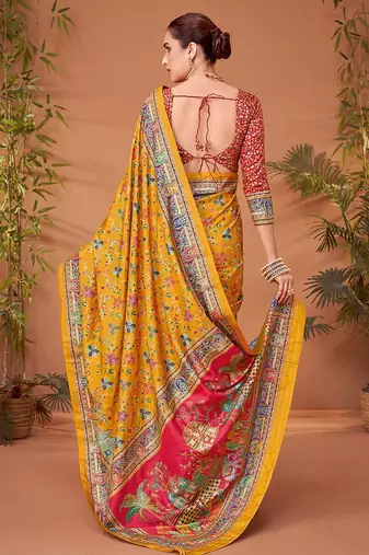 Yellow women ethnic motifs printed viscose rayon saree