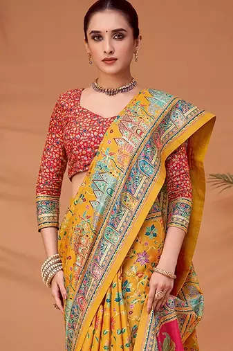Yellow women ethnic motifs printed viscose rayon saree