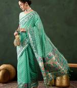 Sea green woven design banarasi saree with blouse piece