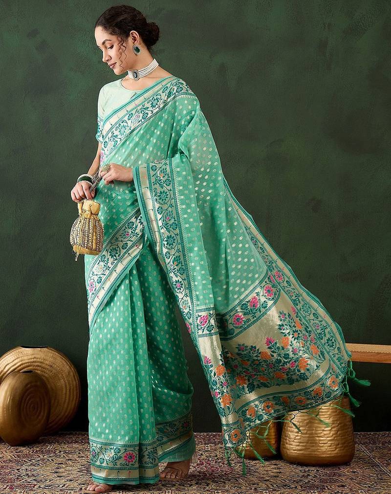 Sea green woven design banarasi saree with blouse piece