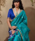 Blue ethnic motifs woven design saree with unstitched blouse