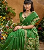 Green ethnic motifs woven design saree with unstitched blouse