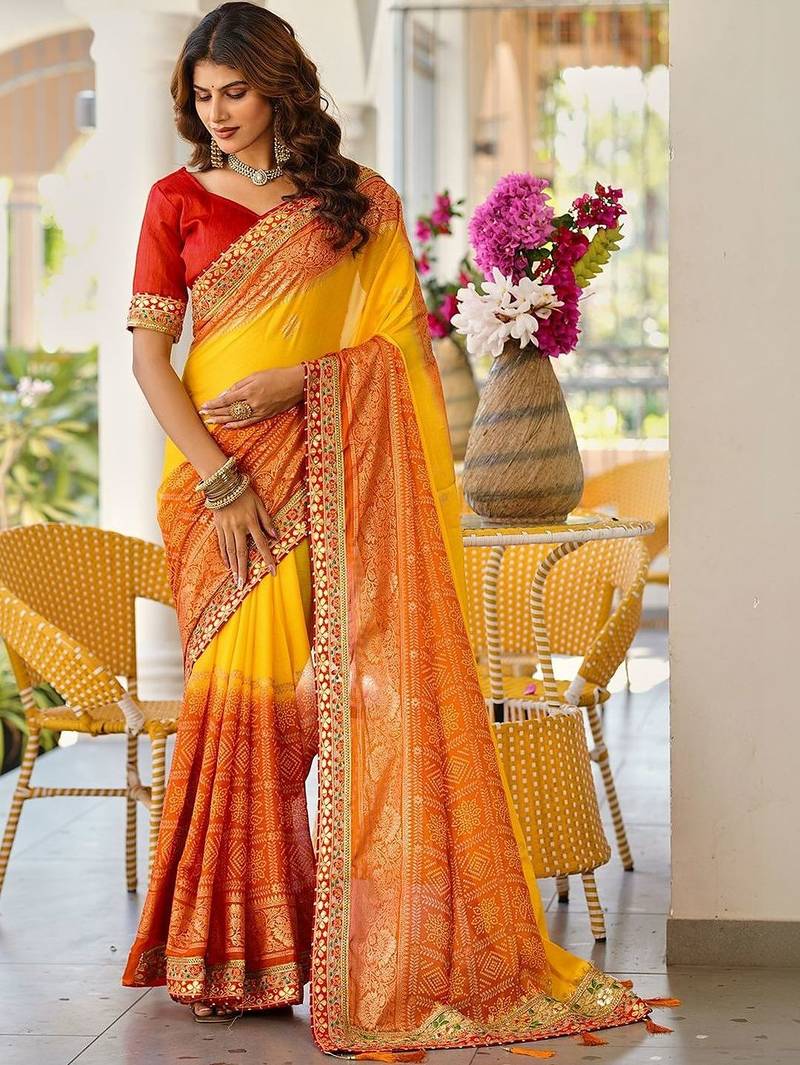 Yellow bandhani printed lace border sarees with contrast blouse piece