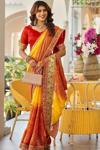 Yellow bandhani printed lace border sarees with contrast blouse piece