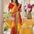 Yellow bandhani printed lace border sarees with contrast blouse piece