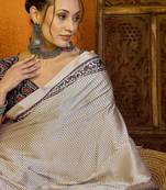 Cream ethnic motifs printed satin saree with blouse