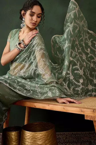 Sea green embroidered saree with blouse piece