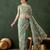 Sea green embroidered saree with blouse piece