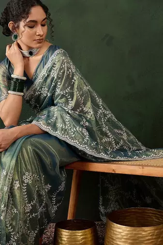 Teal ethnic motif embroidered saree with blouse piece