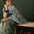 Teal ethnic motif embroidered saree with blouse piece
