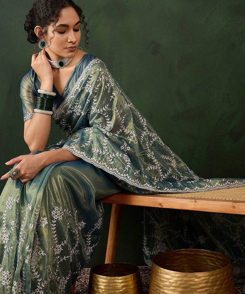 Teal ethnic motif embroidered saree with blouse piece