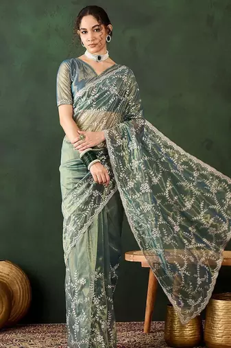 Teal ethnic motif embroidered saree with blouse piece