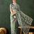 Teal ethnic motif embroidered saree with blouse piece