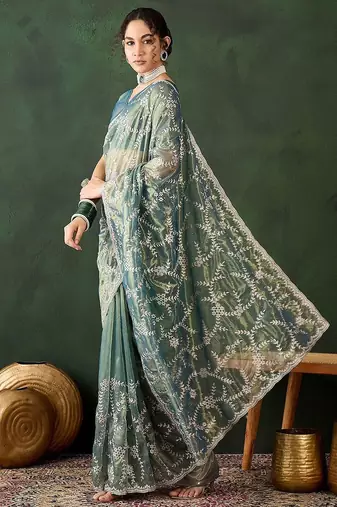 Teal ethnic motif embroidered saree with blouse piece