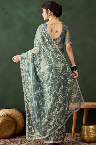 Teal ethnic motif embroidered saree with blouse piece