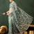 Teal ethnic motif embroidered saree with blouse piece