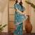 Teal floral embroidered sequinned saree