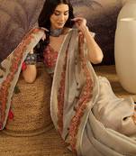 Cream motifs printed saree with unstitched blouse