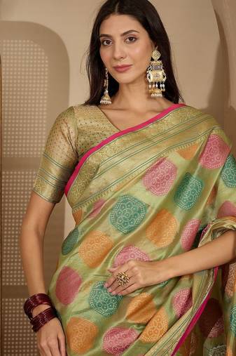 Green ethnic motifs woven design zari organza saree