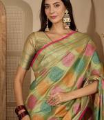 Green ethnic motifs woven design zari organza saree