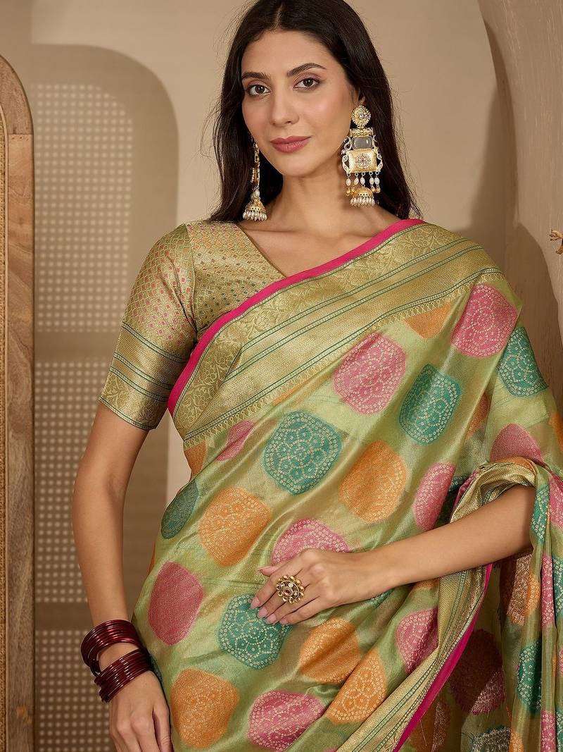 Green ethnic motifs woven design zari organza saree