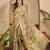 Green ethnic motifs woven design zari organza saree