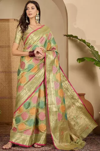 Green ethnic motifs woven design zari organza saree