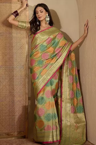 Green ethnic motifs woven design zari organza saree