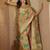 Green ethnic motifs woven design zari organza saree