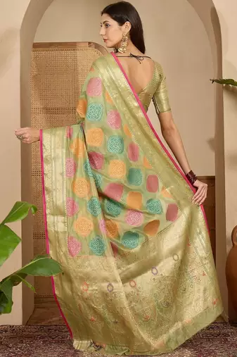 Green ethnic motifs woven design zari organza saree