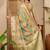Green ethnic motifs woven design zari organza saree
