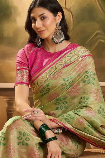 Green woven design floral patola saree