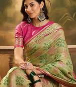 Green woven design floral patola saree
