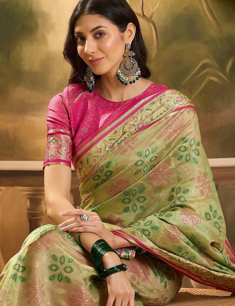 Green woven design floral patola saree