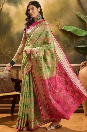 Green woven design floral patola saree