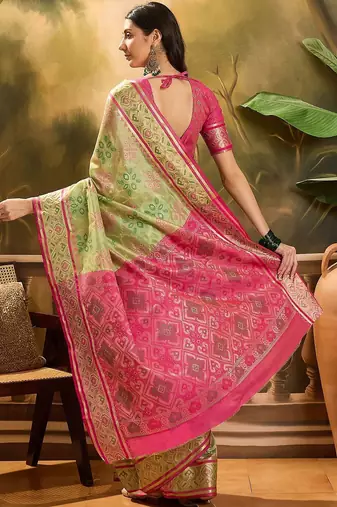 Green woven design floral patola saree