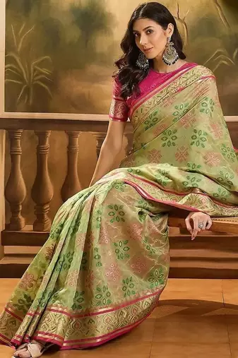 Green woven design floral patola saree