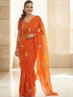 Orange ethnic motifs embroidered satin heavy work saree 1