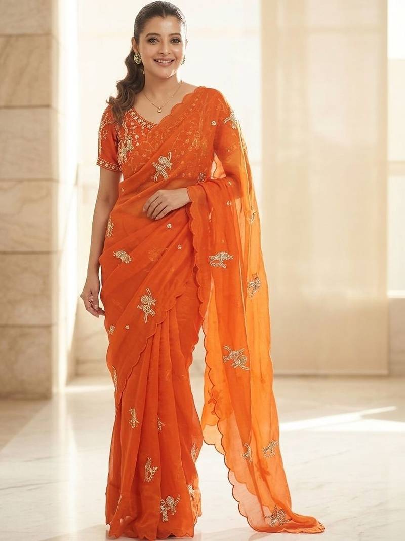 Orange ethnic motifs embroidered satin heavy work saree