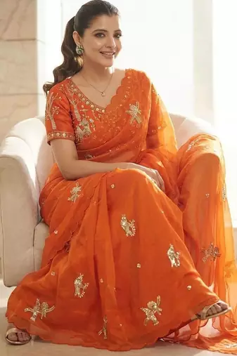 Orange ethnic motifs embroidered satin heavy work saree