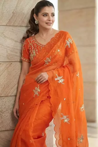 Orange ethnic motifs embroidered satin heavy work saree